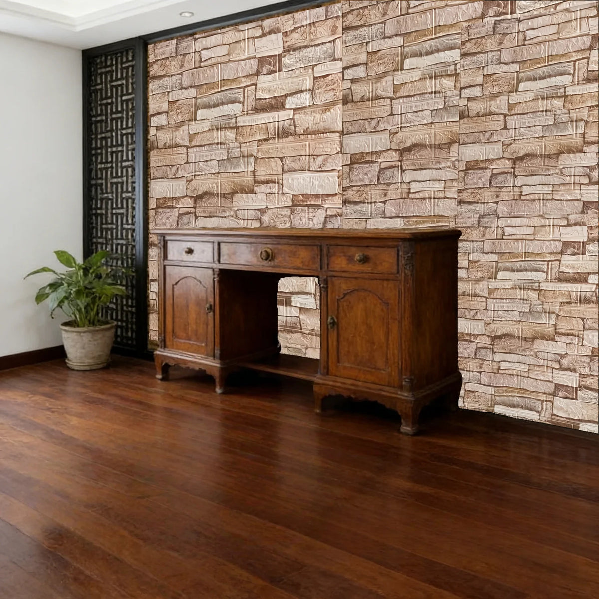 A dark wood antique cabinet sits against a textured stone wall in a room with a wooden floor.