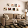 A living room display featuring clear acrylic floating record shelves mounted on a white wall.