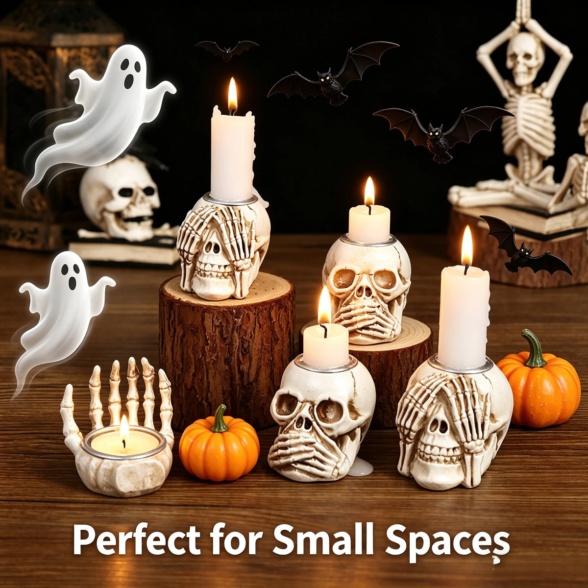 A collection of resin skull candle holders and bat decorations on a wooden surface.
