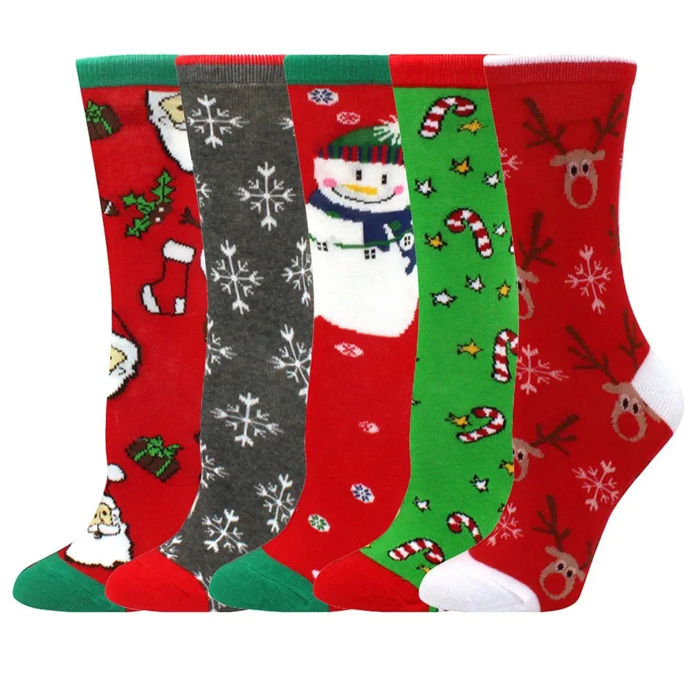 A stack of five Christmas women's socks featuring reindeer, tree, and festive patterns in red, green, and white.