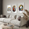 Three modern canvas wall art prints featuring colorful abstract designs and headphones displayed on a light gray wall.