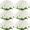 A cluster of white velvet artificial roses used for bouquets and home décor.