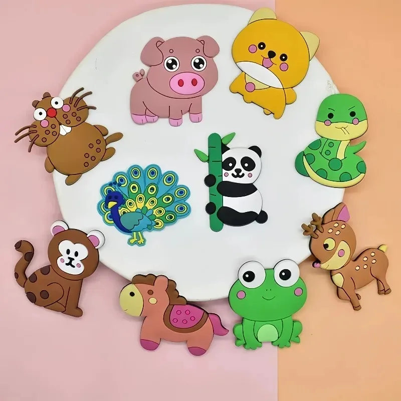 A collection of twelve soft pastel animal fridge magnets featuring various cute animals like a pig, lion, monkey, and frog.