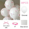 A set of 39 white latex balloons with pink bows, a pink ring, and glue dots for decoration.
