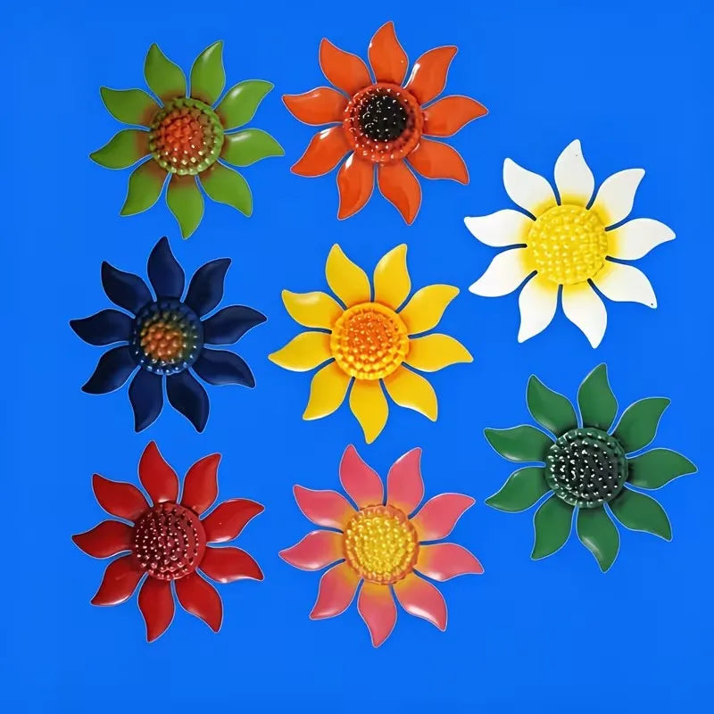 A set of nine metal flower wall decorations in various colors including orange, yellow, red, and green against a blue backgro