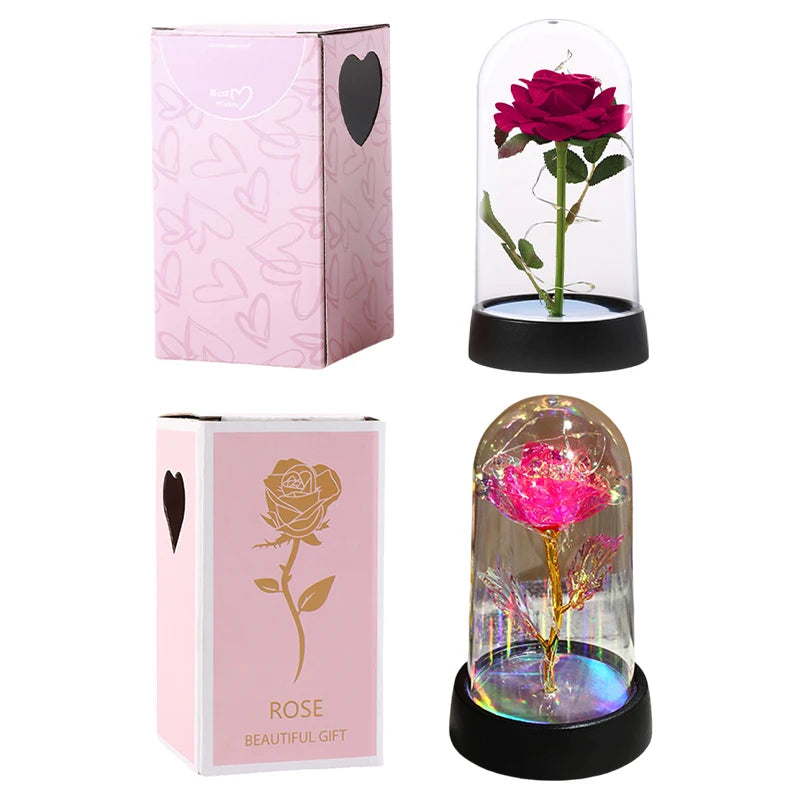 A pink rose in a glass dome with an LED light, presented in its packaging.