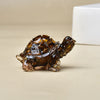 Glänzende bernsteinfarbene Kristallfigur einer Schildkröte, zum Heimdekor.