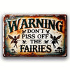 A vintage, rusted metal tin sign with the text WARNING DON'T PISS OFF THE FAIRIES.
