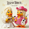 A duo edition figurine of two yellow duck characters, one with blonde hair and a pink hat, holding guitars.