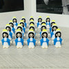 A collection of twenty small figurines dressed in blue and white outfits arranged in rows.