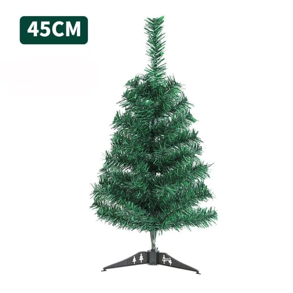 A small, green, artificial Christmas tree with lights on a stand.