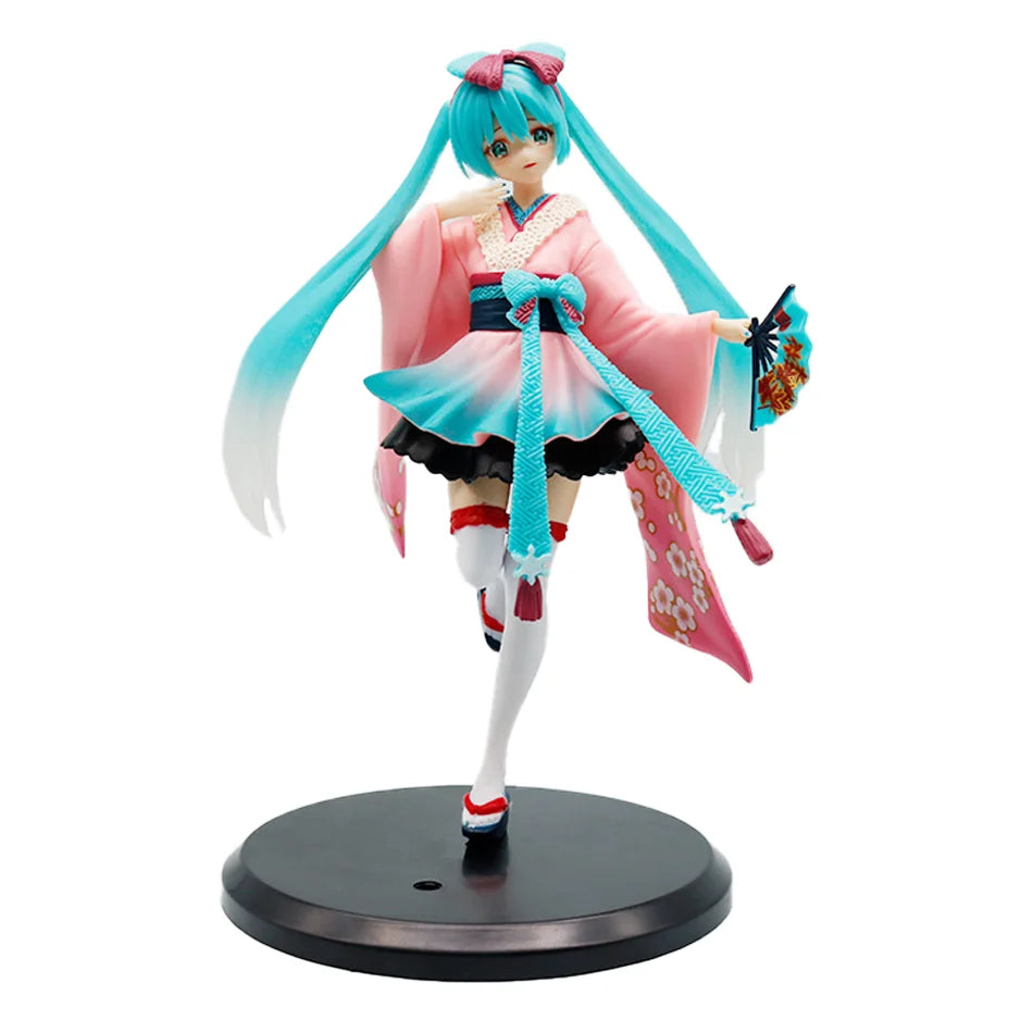 A PVC collectible figurine of Hatsune Miku in a pink and teal outfit with long blue hair.