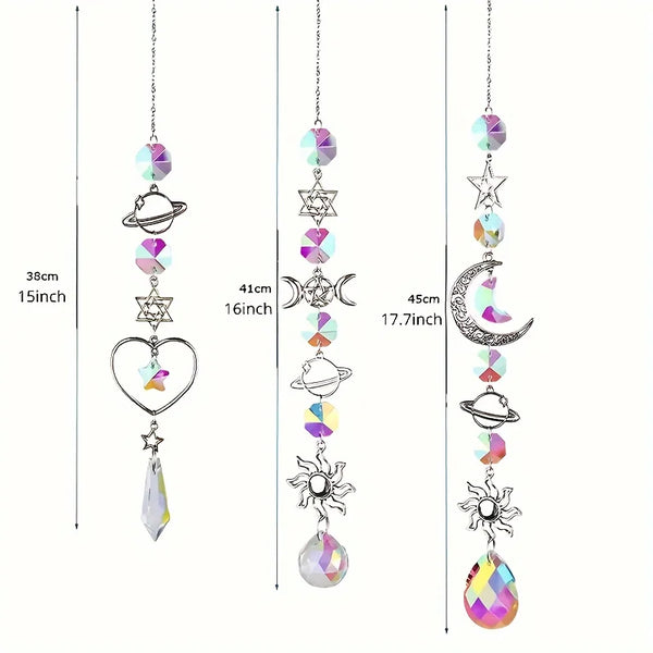 A set of crystal moon and sun wind chimes and dream catchers featuring various celestial elements like stars moons and planet