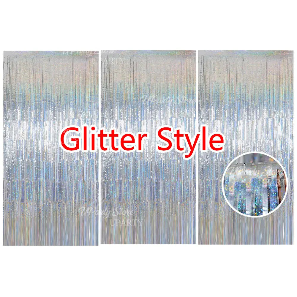 Three panels of silver glitter foil fringe curtains used for party backdrop decor