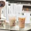 A collection of disposable plastic straws and iced beverages are displayed on a counter.