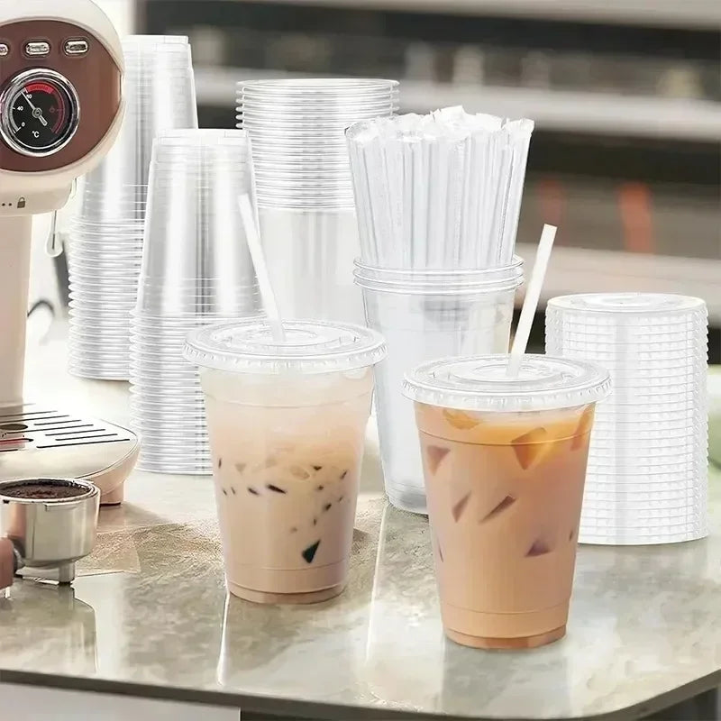A collection of disposable plastic straws and iced beverages are displayed on a counter.