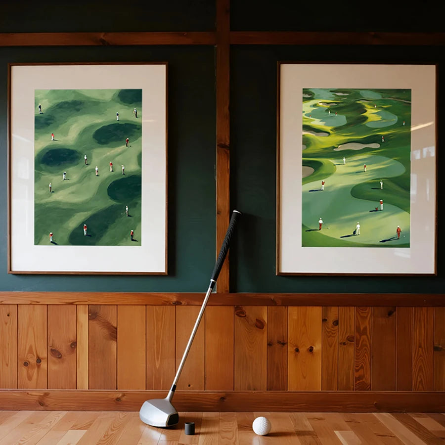 A canvas print featuring a green golf course landscape with small figures, displayed on a dark green wall above wooden paneli