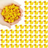 A pile of yellow miniature resin witch hat ducks for crafting and decorating