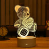 A glowing acrylic night light shaped like a teddy bear and heart, powered by a USB connection.