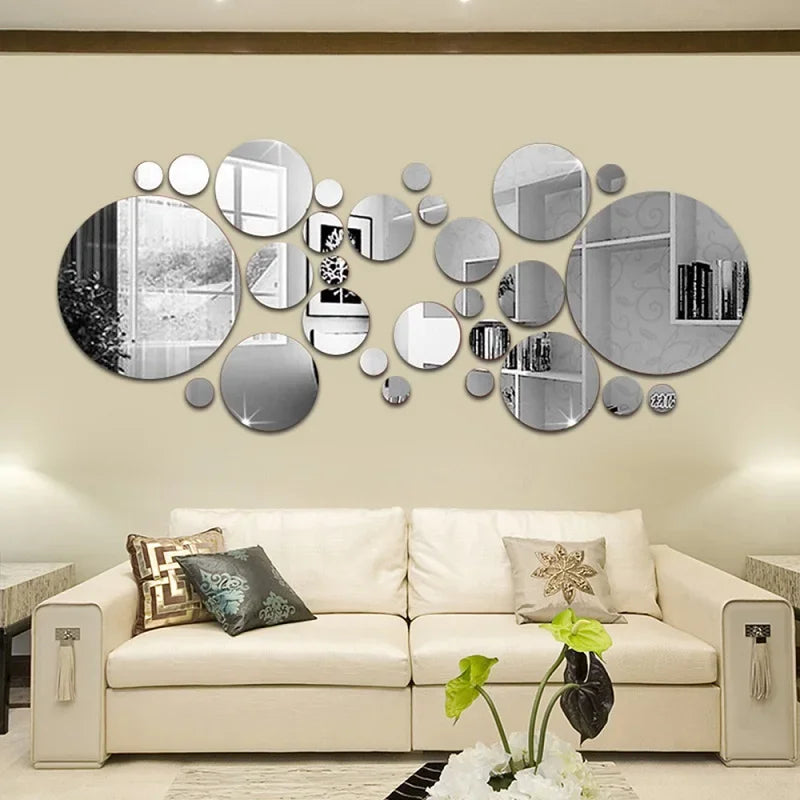 A decorative wall display featuring various sized, round acrylic mirror stickers in silver and black polka dots.