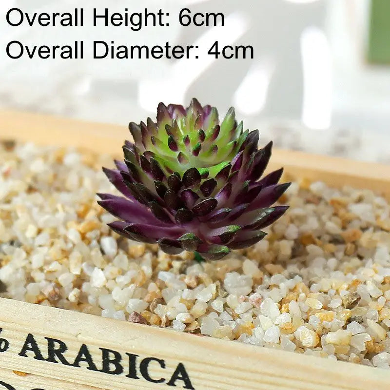 Mini artificial succulent bonsai ball with a dark purple and green rosette placed in a wooden tray filled with sand.