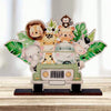 A wooden ornament featuring various jungle animals like a lion, tiger, and elephant surrounding a vintage car.