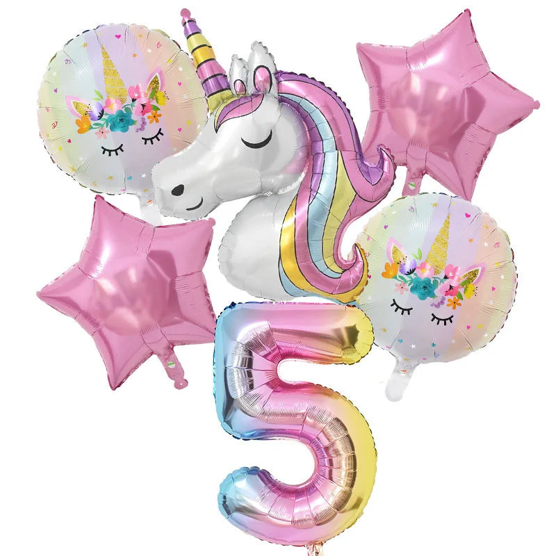 A set of pink and iridescent balloons featuring a unicorn face and the number five balloon.