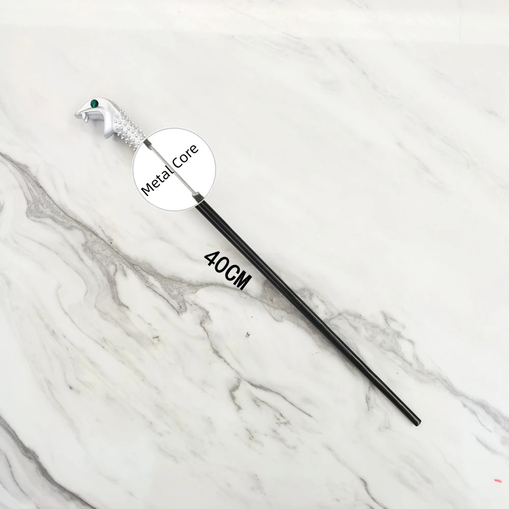 A black metal magic wand replica with a silver handle and a labeled metal core on a white marble surface.