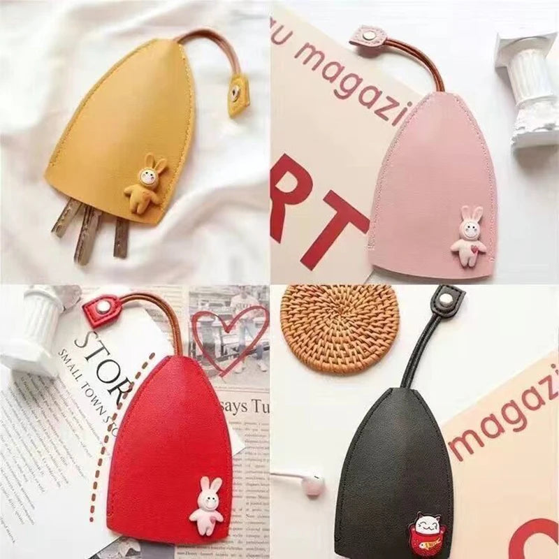 Pink and yellow cartoon PU leather key holder with a pull-out design shown against a white background.
