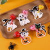 A collection of Halloween-themed lollipop holder cards featuring ghosts and pumpkins in black, white, and orange colors.