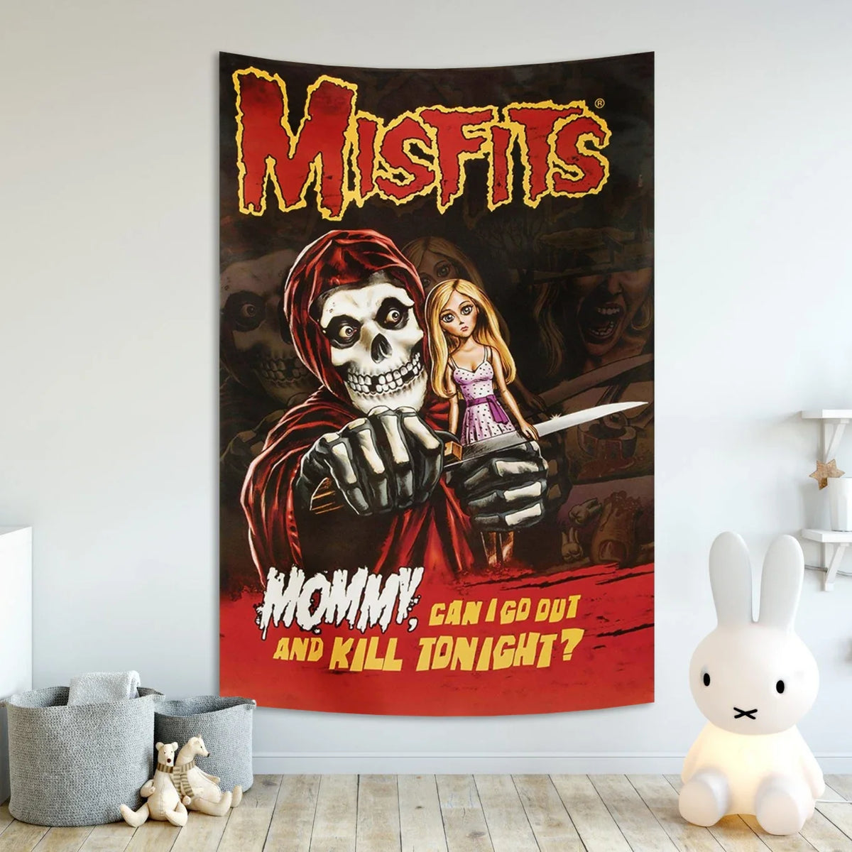 A dark tapestry wall art featuring a skull and a woman with a knife, with the text Mommy can I go out and kill tonight?