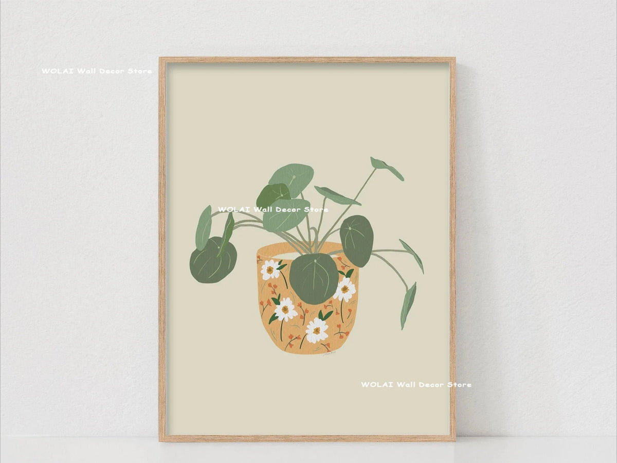 Botanical philodendron canvas wall art featuring a green plant in a terracotta pot on a light background.
