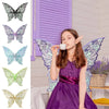 A girl wearing a purple dress and sparkling fairy wings with iridescent details, posing indoors.