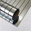 Roll of self-adhesive mirror effect wallpaper showing the reflective silver surface and rolled edges.
