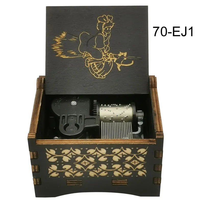 A wooden box containing a music melody box with a gold-colored anime character design.