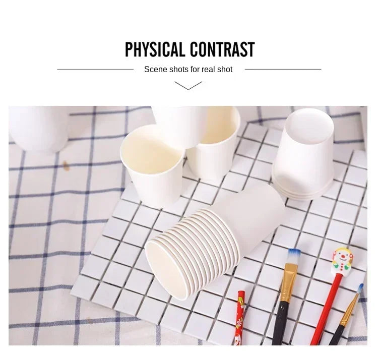 A close-up photo showing various white disposable paper cups of different sizes arranged on a checkered surface.
