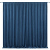 A floor-to-ceiling royal blue velvet curtain with vertical pleats used as an elegant drapery backdrop.