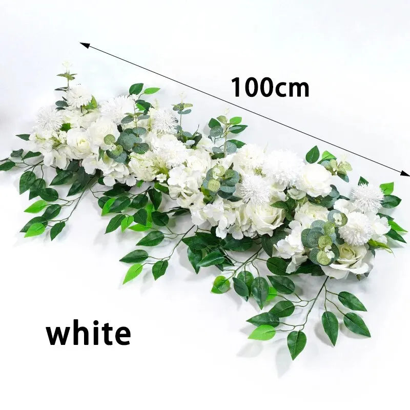 A long arrangement of white artificial roses and green foliage, measuring 100cm.