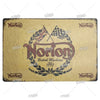 Vintage metal sign for Norton British Machines featuring a crown and laurel wreath design.