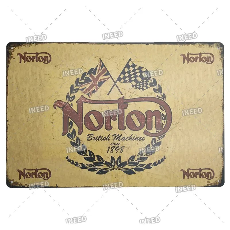 Vintage metal sign for Norton British Machines featuring a crown and laurel wreath design.
