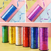 A collection of glitter curling ribbon rolls in various colors including blue, purple, green, gold, and red.