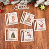 Collection de cartes d'argent en bois décoratives avec des thèmes de Noël comme le Père Noël, les rennes et les bonhommes de 