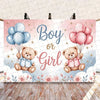 A gender reveal decoration featuring pink and blue balloons and teddy bears on a banner.