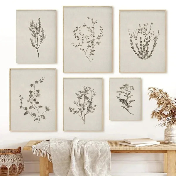 A set of five framed canvas prints featuring delicate botanical illustrations on a light background.
