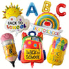 A set of eight foil decorations including a sun, letter B, letter C, and various back to school themed items.