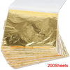 A stack of 200 imitation gold leaf sheets for gilding and crafting.