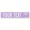A rectangular purple sign with white text that reads YOUR TEXT HERE