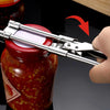 A hand uses an adjustable stainless steel jar and bottle opener to open a red-colored glass jar.