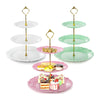 A three-tier plastic cupcake stand with pink and green plates and gold accents.