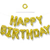 A string of gold foil balloons spelling out HAPPY BIRTHDAY for a celebration.
